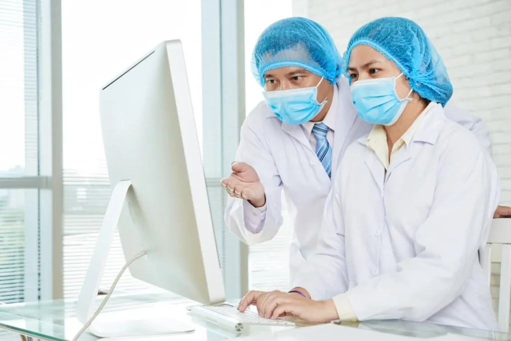 discussing treatment methods with colleague 1098 17088