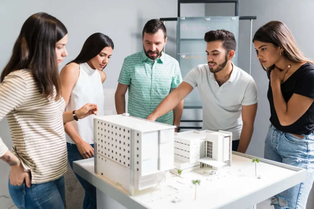 hispanic architectural team planning new project office